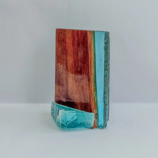 Handcrafted wood and resin decoration with a rippling pattern and shades of blue.